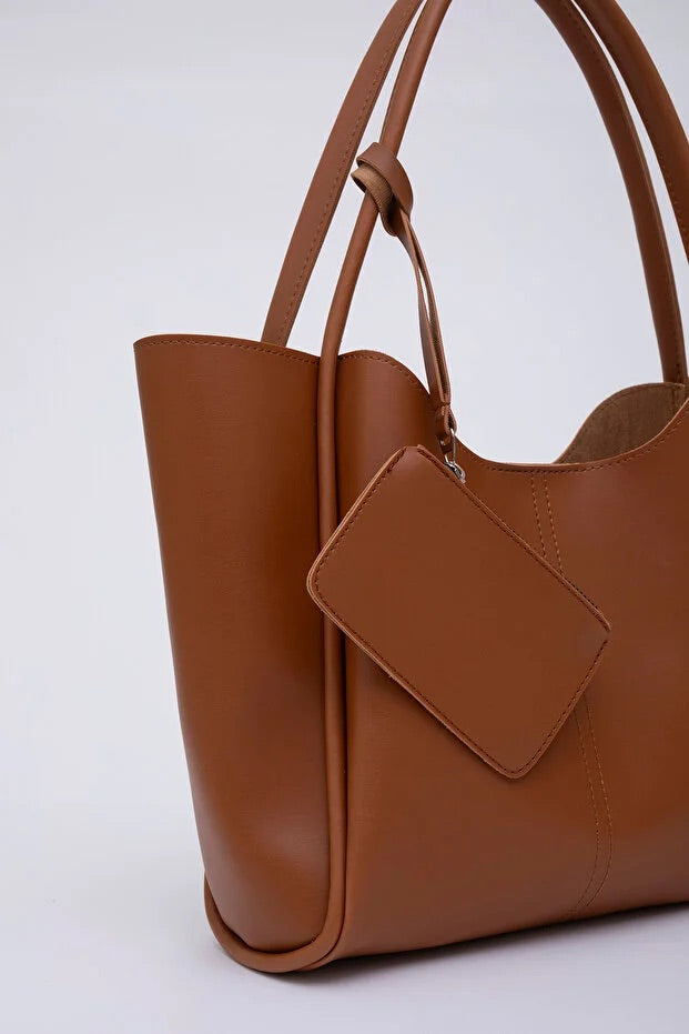 Tan SHK108 faux leather women hand and shoulder with wallet and makeup